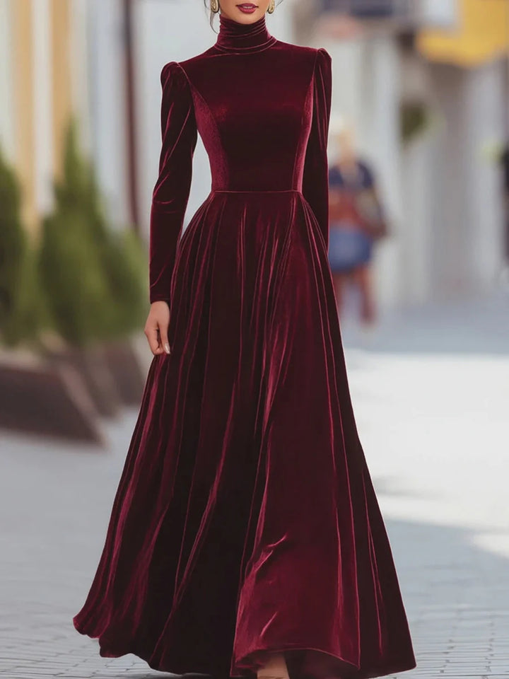 Red velvet dress with high neck, long sleeves, fitted bodice, flared skirt