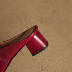 Close-up of red genuine leather mule heel and side slingback strap