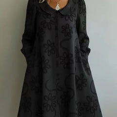 Black embroidered midi dress with V-neck, long puff sleeves, A-line skirt