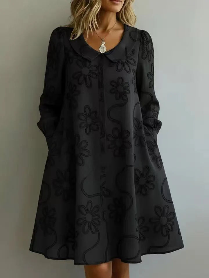 Black embroidered midi dress with V-neck, long puff sleeves, A-line skirt