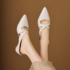 White pointed leather mules with cross-strap, open back, low slip-on heel