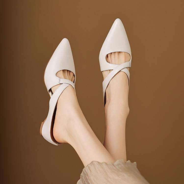 White pointed leather mules with cross-strap, open back, low slip-on heel