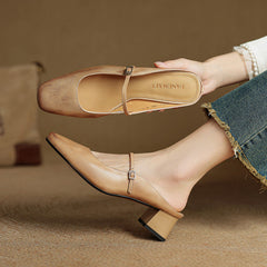 Apricot leather mules with square toe, T-strap buckle, and low block heel