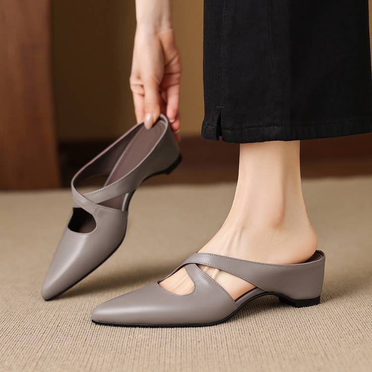 Gray pointed-toe mules with crisscross straps and low block heel