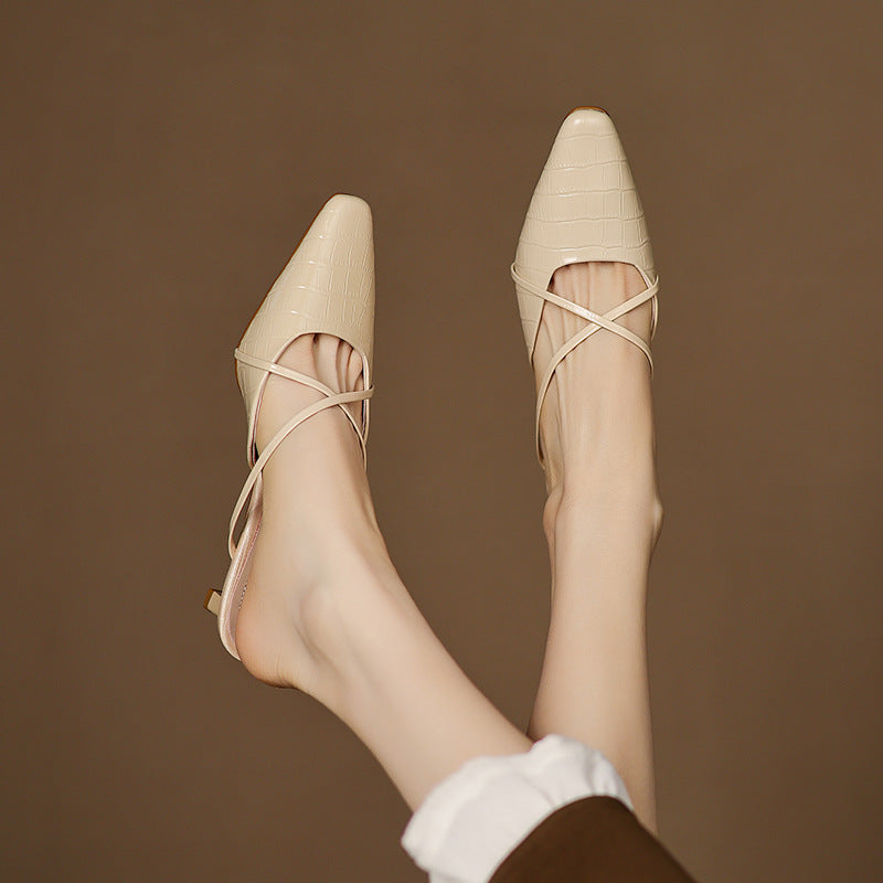 Beige genuine leather mules on model, pointed toe, crisscross straps, low heel