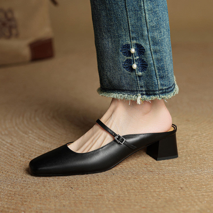 Black genuine leather mules with square toe, side strap buckle, and block heel