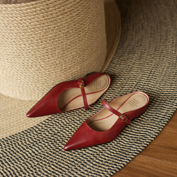 Maroon leather mules with pointed toe, slingback strap, and low block heel, side view