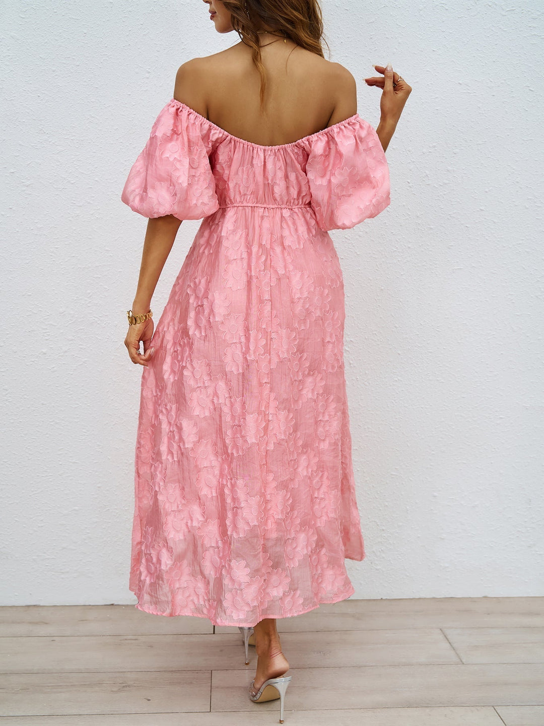 Pink off-shoulder midi dress, back view, with puff sleeves and full gathered skirt