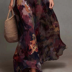 Women’s pleated maxi dress with watercolor floral print, cap sleeves, V-neck, flowing skirt