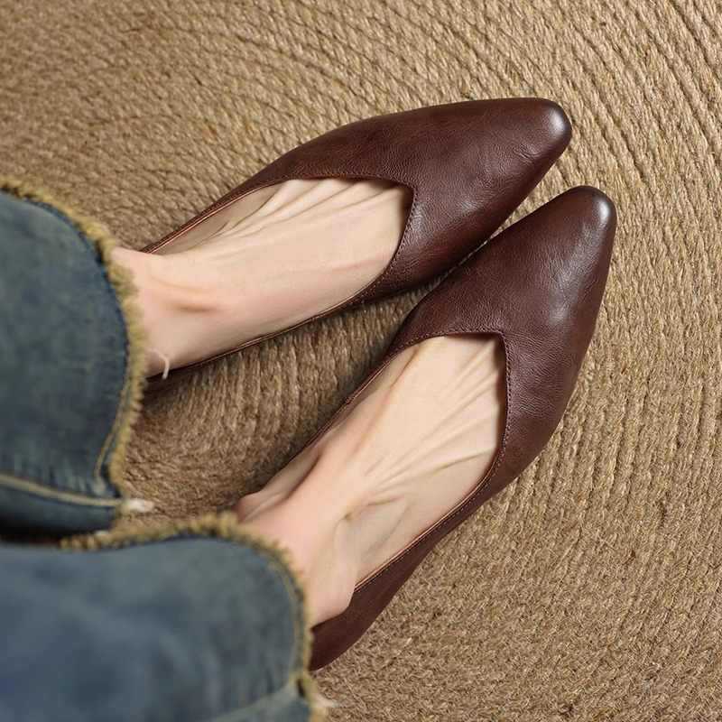 Dark brown genuine leather mules, close-up of almond toe and open heel