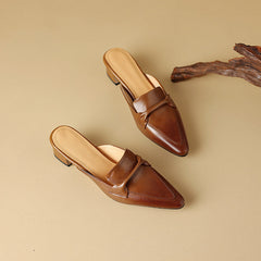 Brown leather mule pair with tan insoles, slip-on style with strap detail