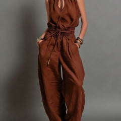 Rust brown halter wide-leg jumpsuit with tie neckline and elastic waist drawstring