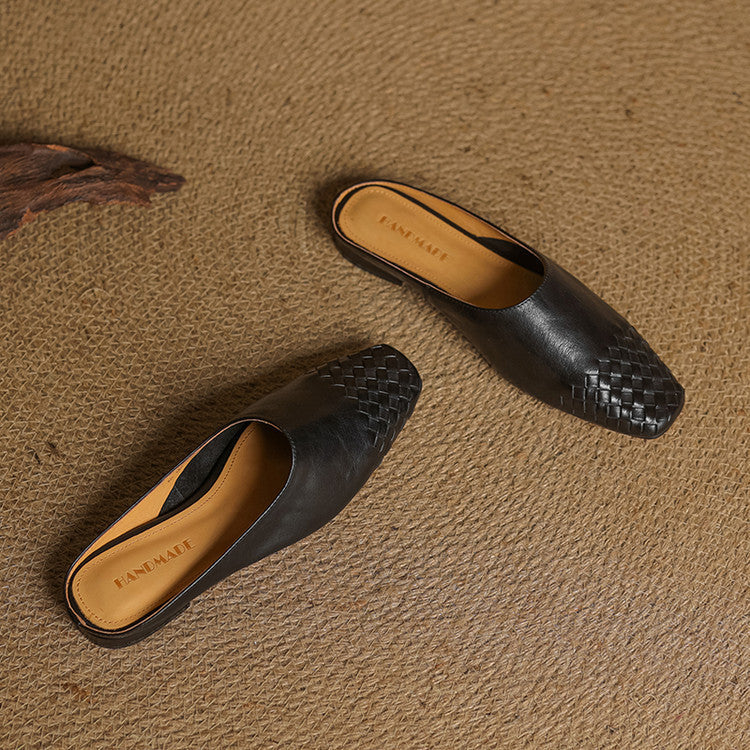 Black leather mule slides with woven front pattern, low profile heel