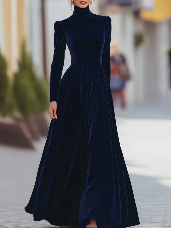 Dark blue velvet dress with high neck, long sleeves, fitted bodice, flared skirt