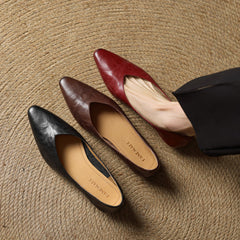 Assorted leather mules: black, maroon, and brown pointed toes with low heels