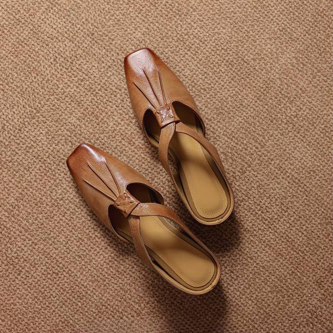 Tan square-toe genuine leather mules with front cutout strap and slip-on design.