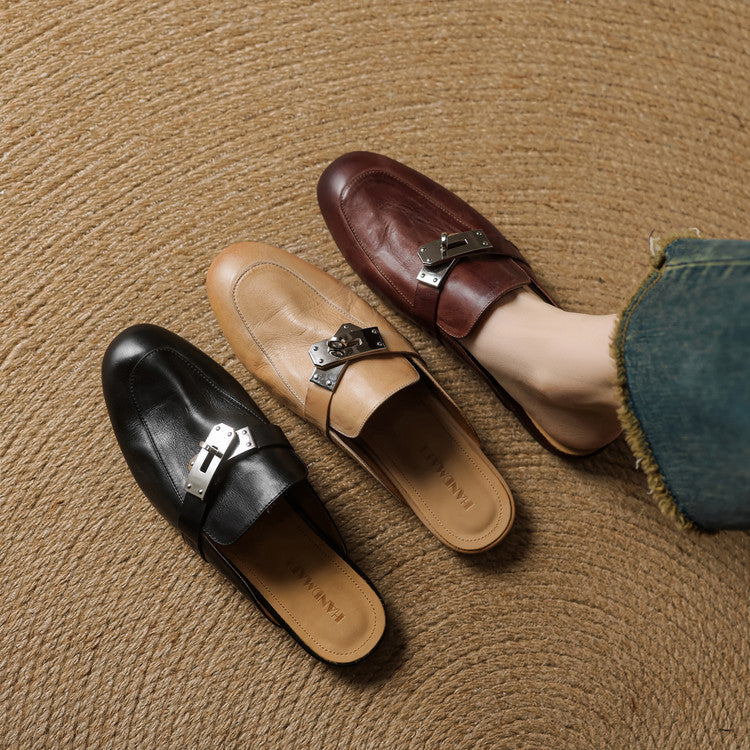 Pair of genuine leather mules in black and brown with silver buckle strap