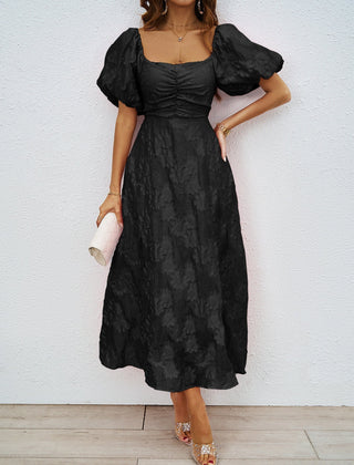 Black off-shoulder midi dress with dramatic puff sleeves and cinched waist