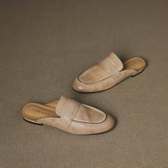 Beige and tan leather slip-on mules, flat sole and stitched vamp detail