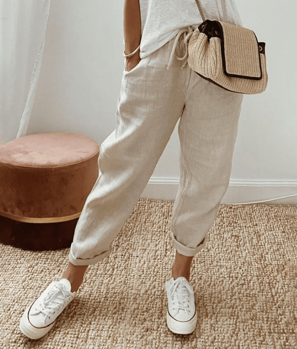 Light beige cotton trousers with elastic waist and cuffed hems