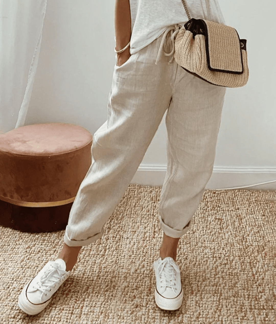 Light beige cotton trousers with elastic waist and cuffed hems
