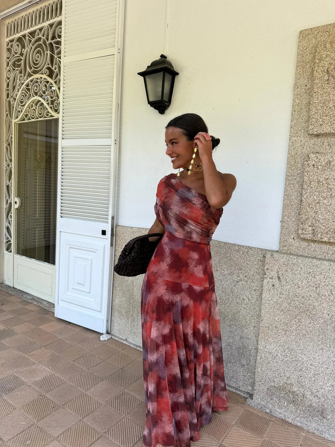 Toledo maxi dress in red and burgundy print, off-shoulder silhouette and full length skirt