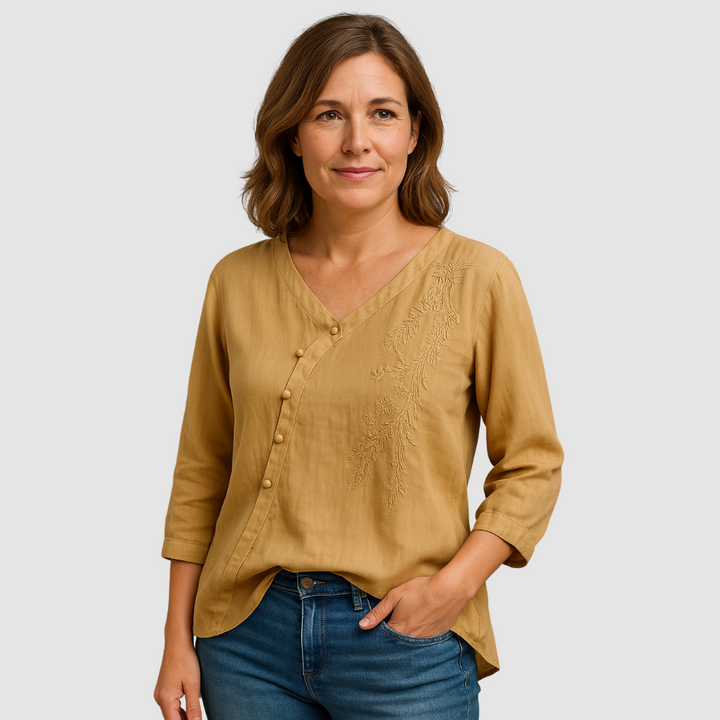 Tan breathable V-neck button blouse with textured embroidered front and three-quarter sleeves