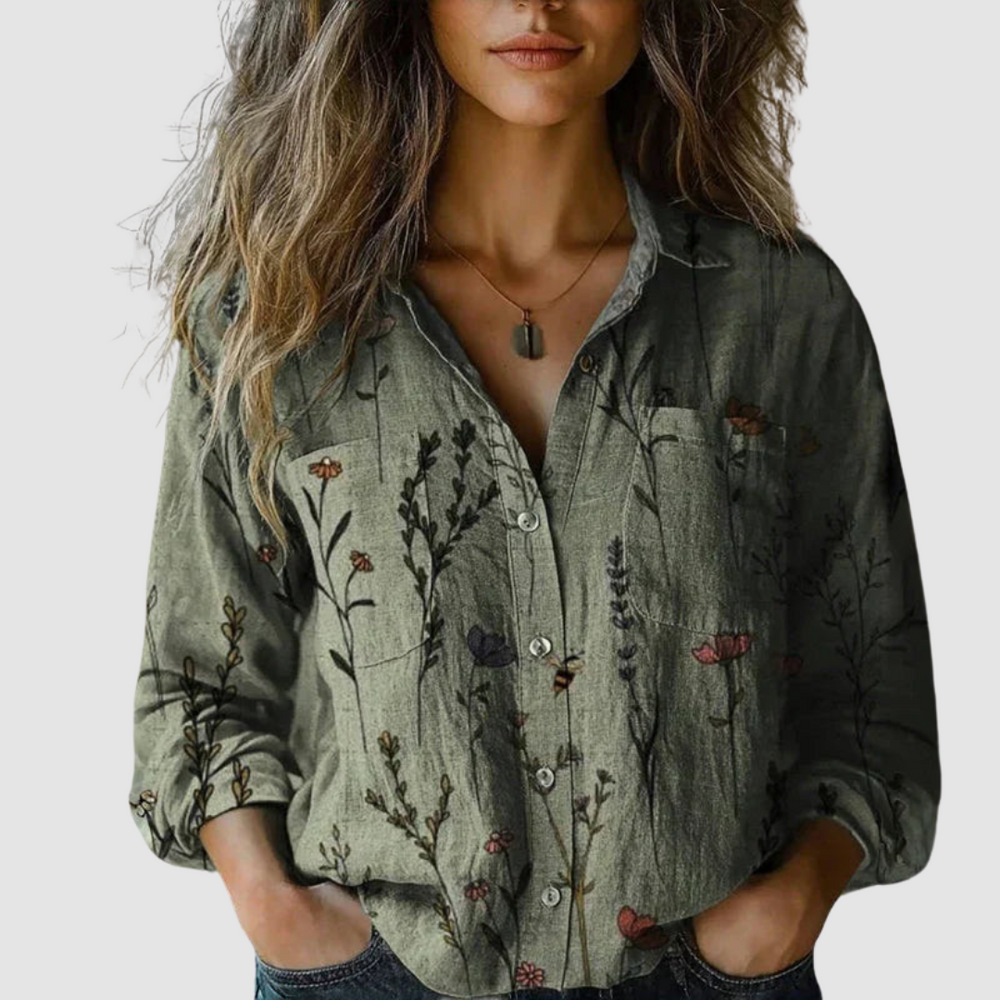 Green vintage printed blouse with floral motif, button front, long sleeves, patch pockets