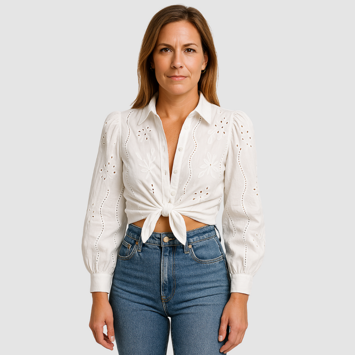 White button-front blouse with puff sleeves, eyelet cutwork and tied waist detail