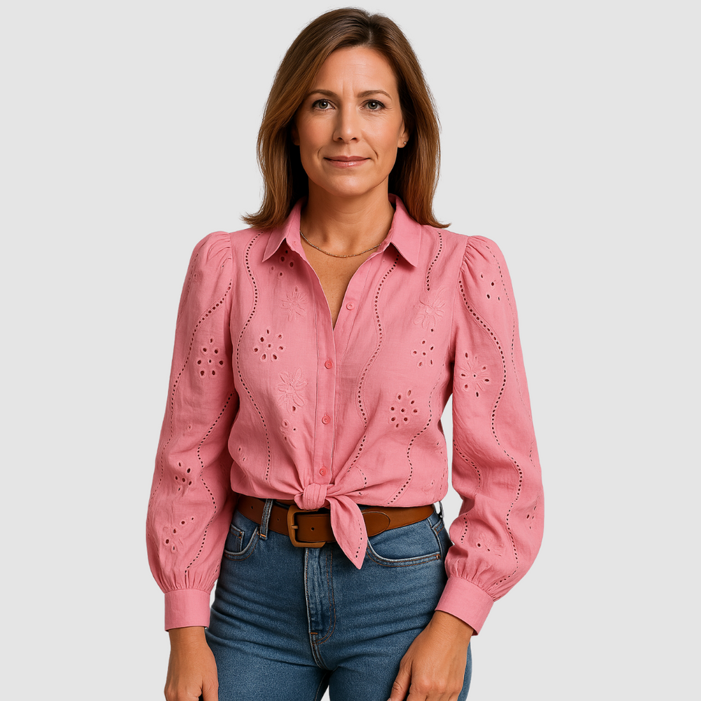 Pink button-front blouse with puff sleeves, eyelet embroidery, and tie waist