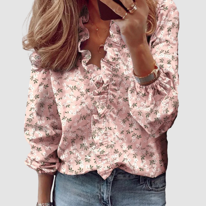 Pink floral long-sleeve blouse with ruffled V-neck and button-front detailing