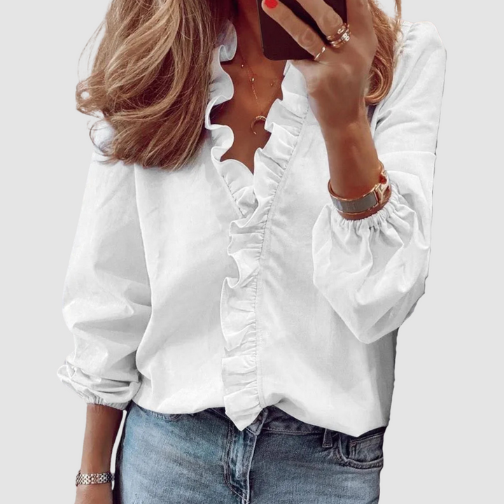 White ruffle V-neck blouse with long puff sleeves and button front