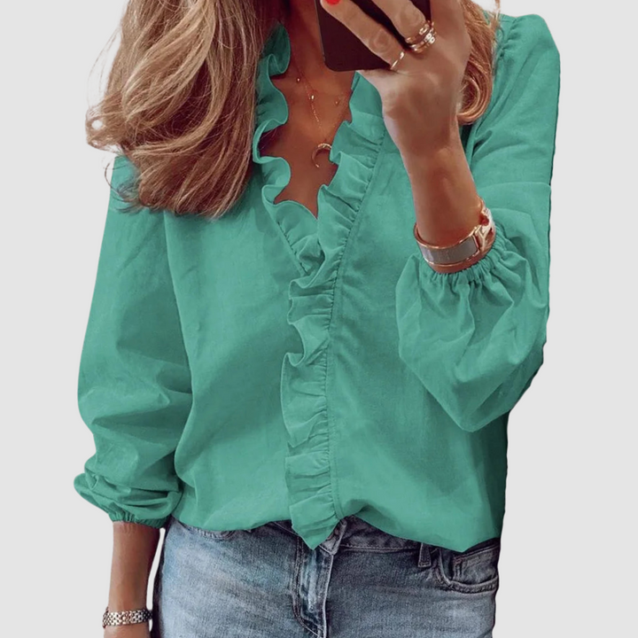 Green ruffle V-neck blouse with long puff sleeves and button front