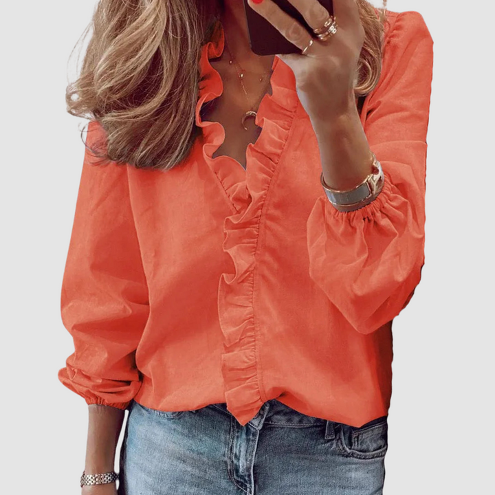 Coral orange ruffle V-neck blouse with long puff sleeves and button front