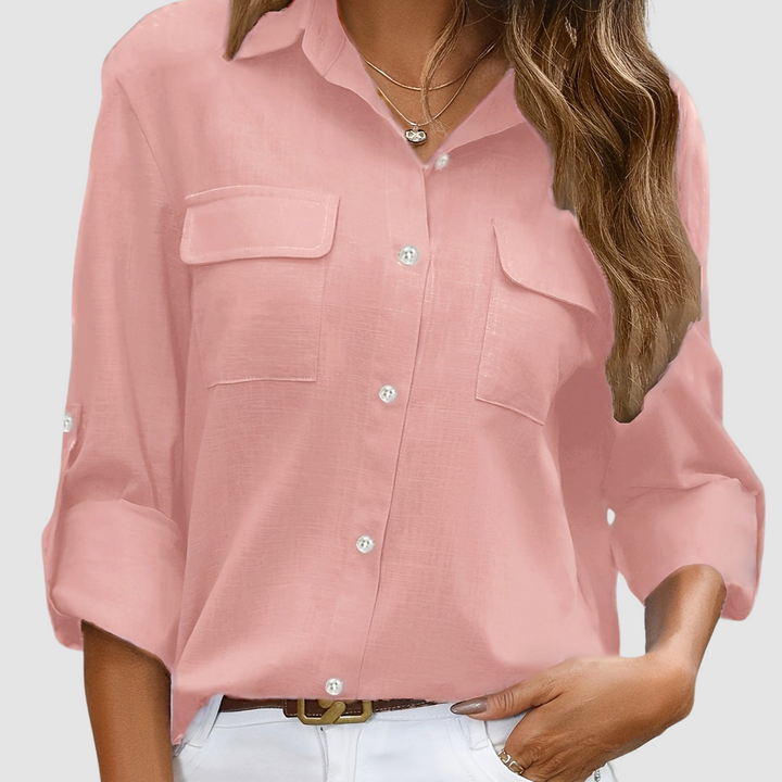 Women's pink button-up blouse with chest flap pockets and long sleeves