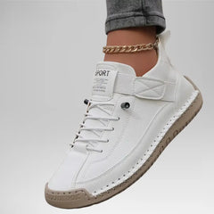 White comfort support sneaker with quilted strap, lace-up front, and tan textured sole