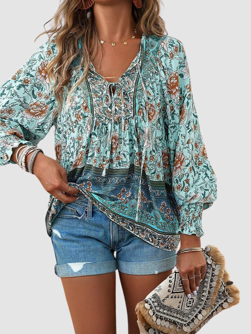 Teal floral peasant blouse with V-neck tie and long puff sleeves, ornate border