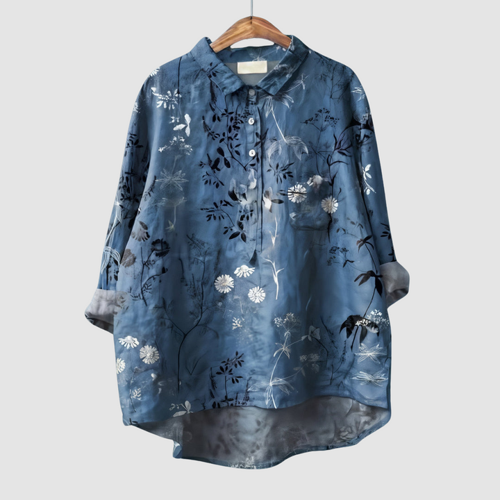 Blue botanical print button-up blouse with pointed collar and chest pocket, white flowers