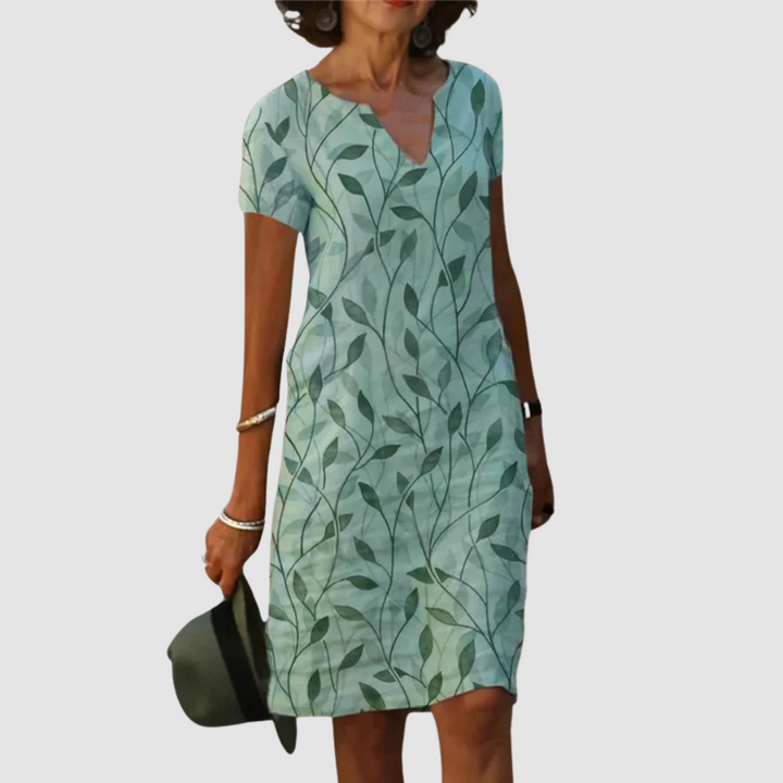 Casual printed dress in light green with leaf pattern, short sleeves, V-neck.