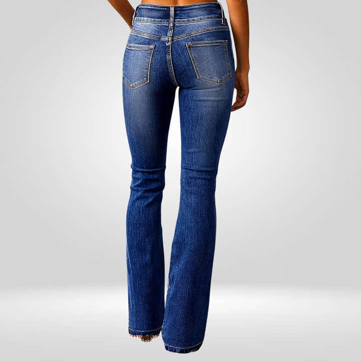 Dark blue high-waist flared jeans, back view with patch pockets and yoke