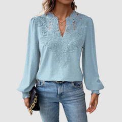 Light blue lace blouse with V-neck and long puff sleeves