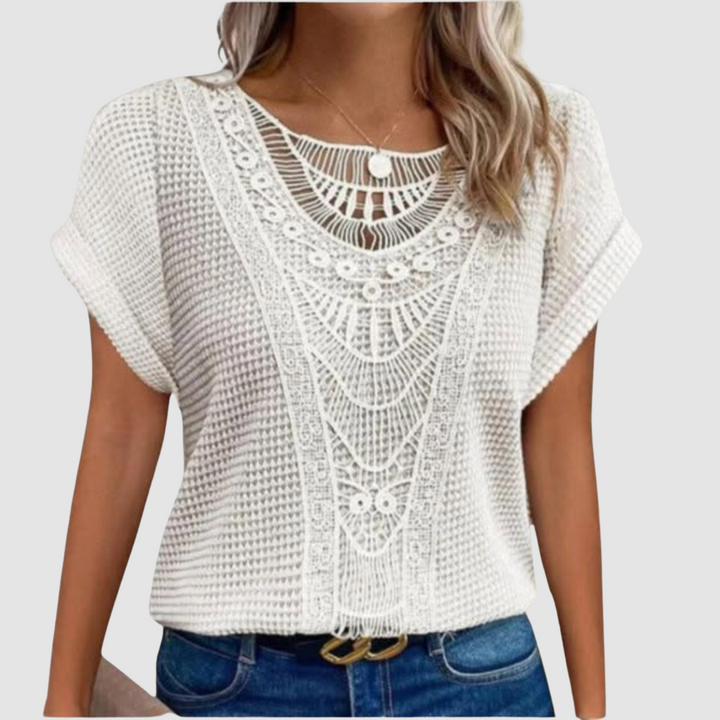 White lace crochet top with scalloped neckline and short flutter sleeves