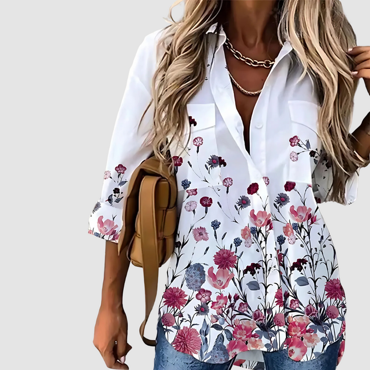 White button-up blouse with pink and purple garden floral print hem