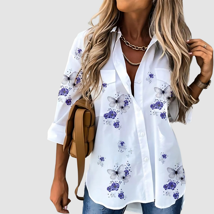 White button-up blouse with blue floral print and point collar