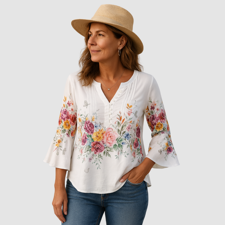 Soft white floral blouse with V-neck and three-quarter bell sleeves