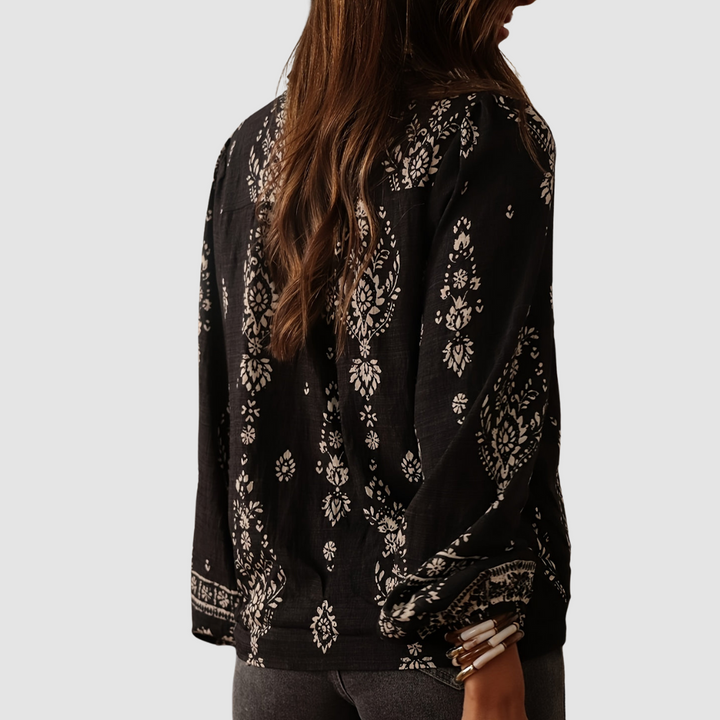 Black boho blouse back view with white floral print and long sleeves