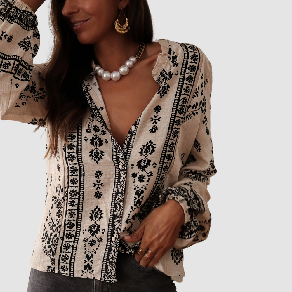 Soft beige boho blouse with black floral embroidery, deep V-neck, long sleeves