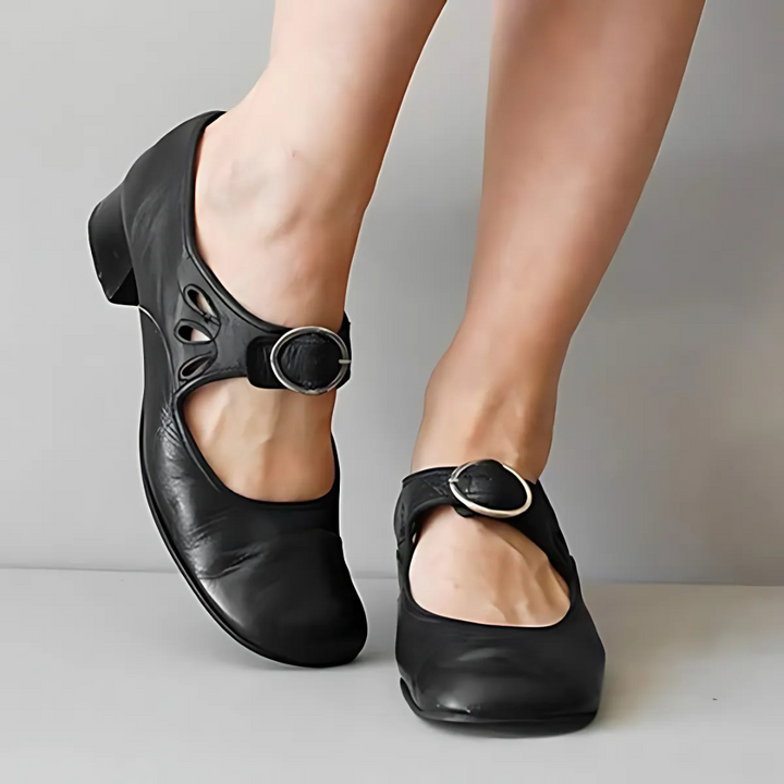 Black leather sandals with oval buckle straps and cutout toe detail, low block heel