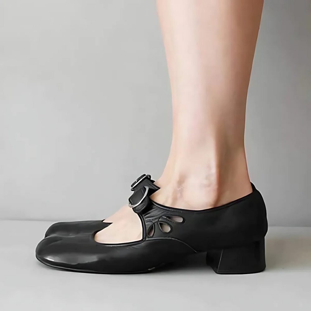 Black leather Mary-jane sandals with buckle strap and chunky low heel, side view