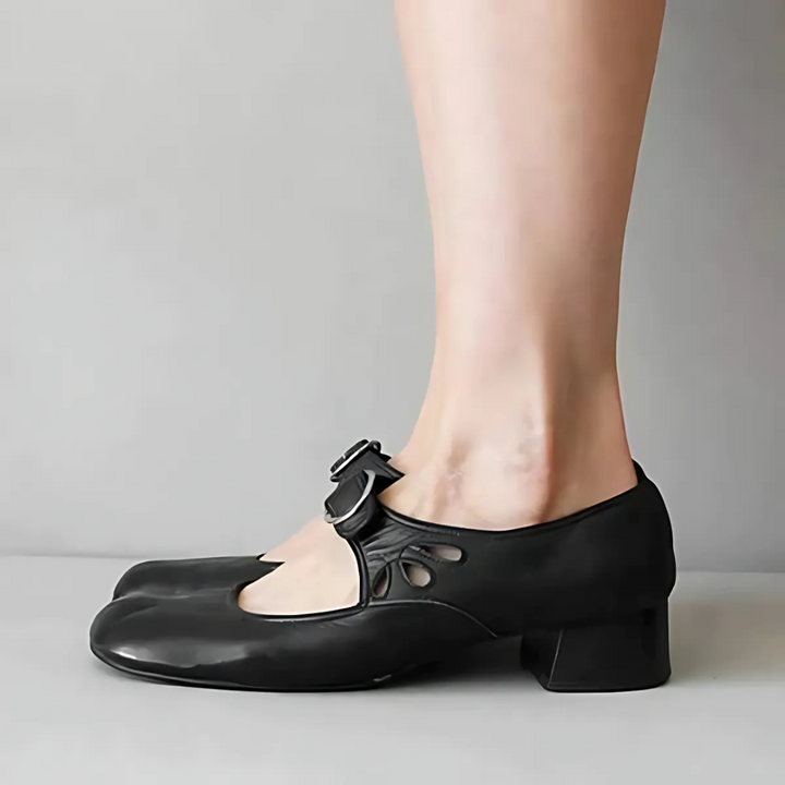 Black leather Mary-jane sandals with buckle strap and chunky low heel, side view